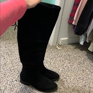 Black thigh high boots.